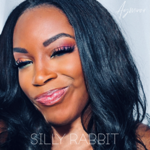 Cover art for Ayminor's new single Silly Rabbit features a close up of black girl 's face with colorful eye shadow
